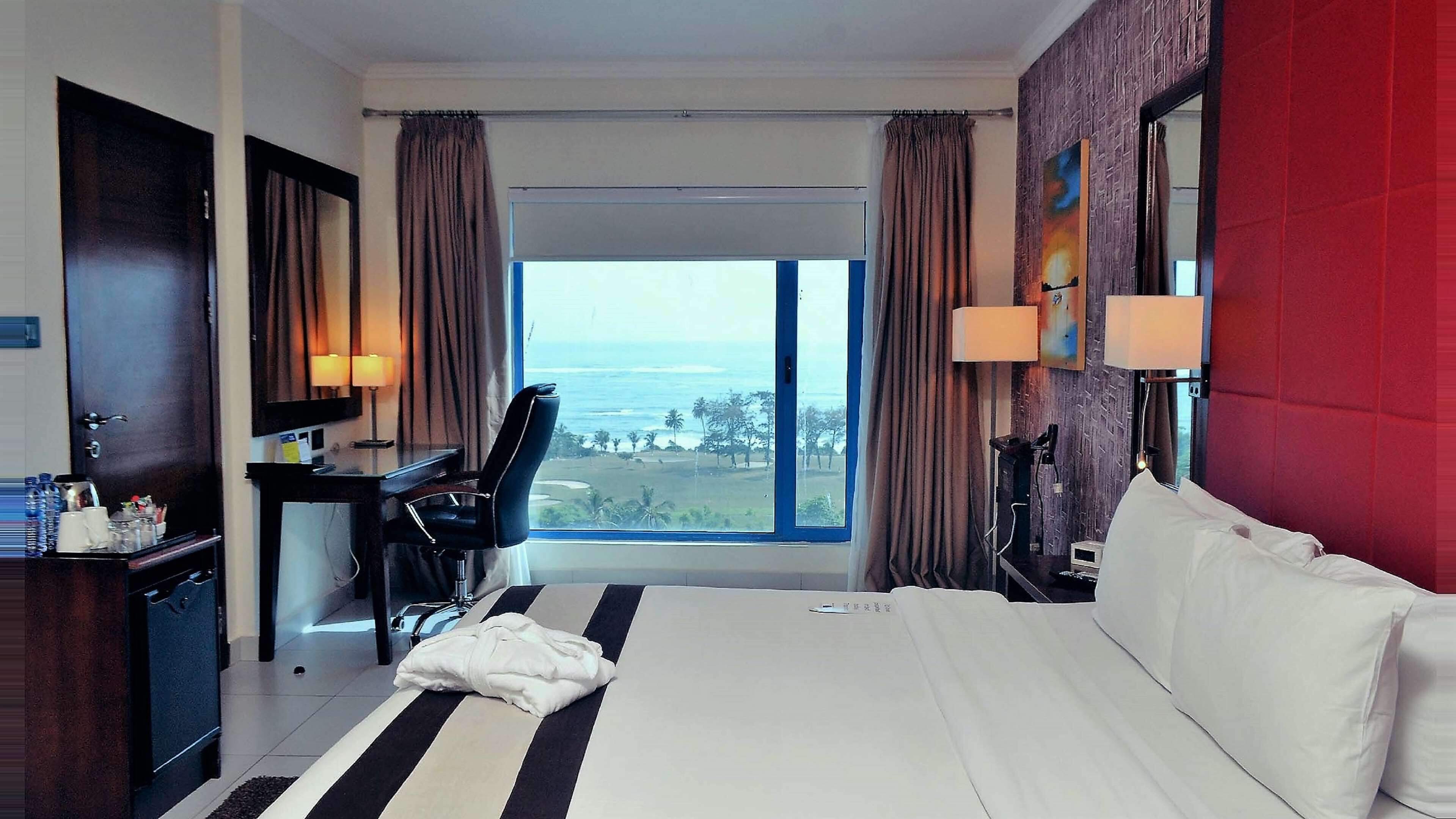 suite, 1 queen bed, non smoking, sea view | in-room safe, desk, iron/ironing board, free cots/infant beds