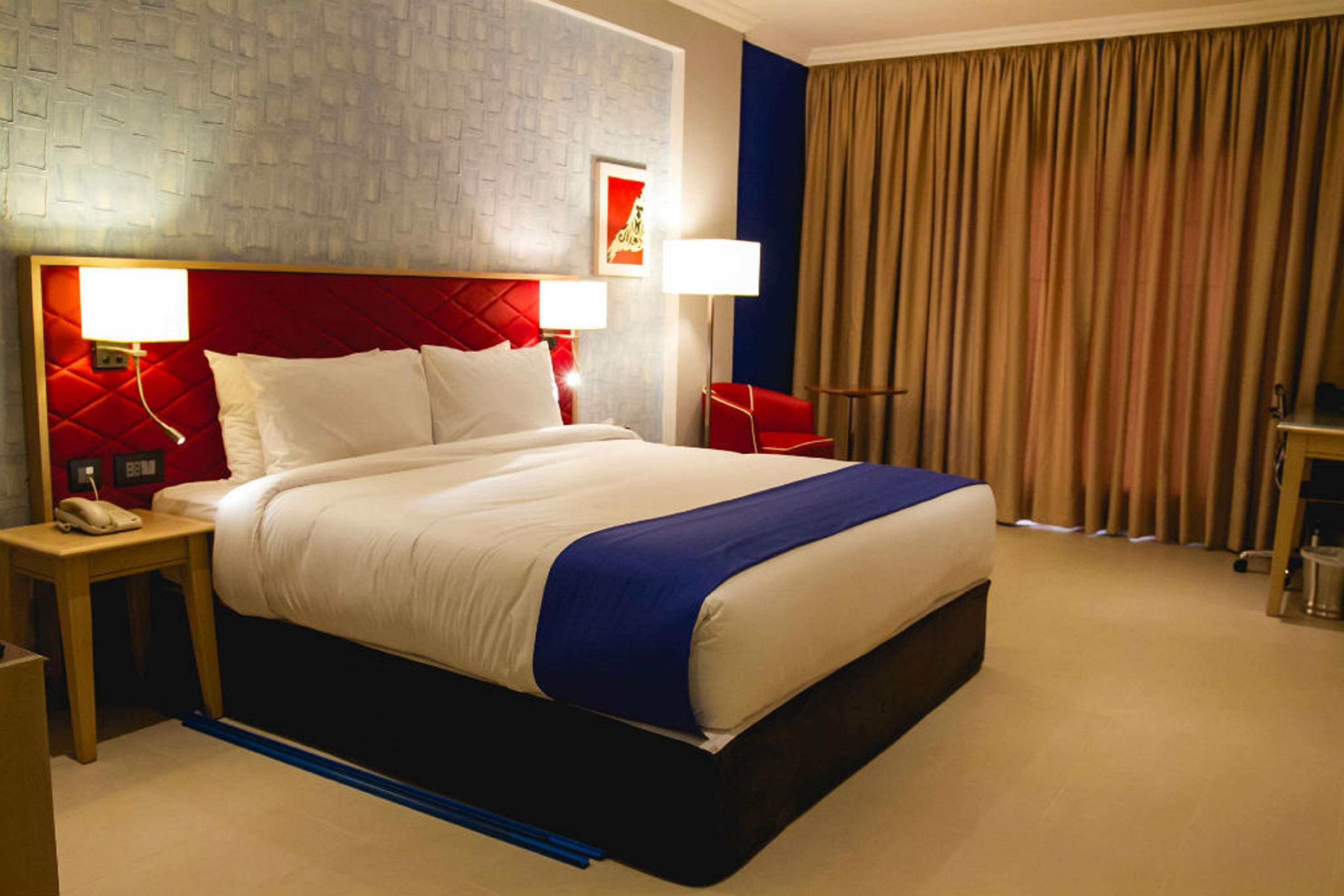 suite, 1 queen bed, non smoking, sea view | in-room safe, desk, iron/ironing board, free cots/infant beds