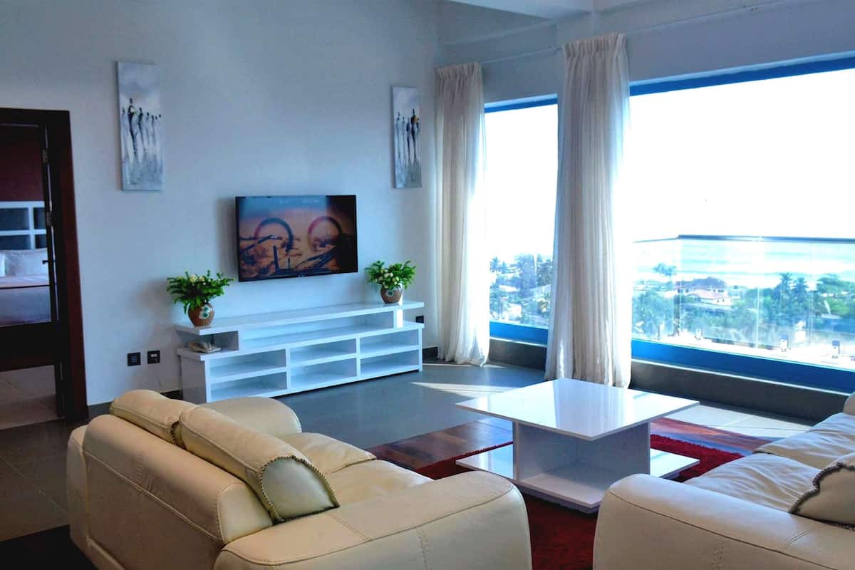 suite, 1 queen bed, non smoking, sea view | in-room safe, desk, iron/ironing board, free cots/infant beds