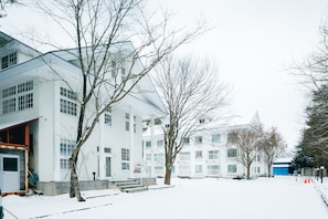 A modern building with multiple windows and a flat roof. - Condominium Excel Hakuba (Hakuba)