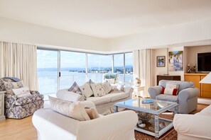 Luxury Villa, 5 Bedrooms, Private Pool, Lakeside | Living room | Flat-screen TV, fireplace - Milkwood Bay Self Catering Villa (Knysna)