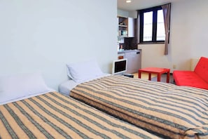 Studio, 2 giường đơn, không hút thuốc, phòng tắm riêng | Truy cập Internet không dây miễn phí, bộ trải giường 