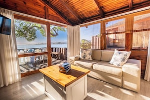 Waterfront Chalet | Living area | 40-inch flat-screen TV with satellite channels, TV, DVD player