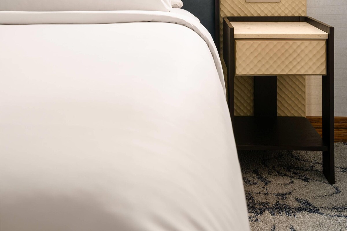 Premium bedding, down comforters, pillowtop beds, in-room safe