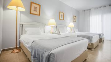 Chambre Triple Deluxe | Draps en coton égyptien, literie de qualité supérieure