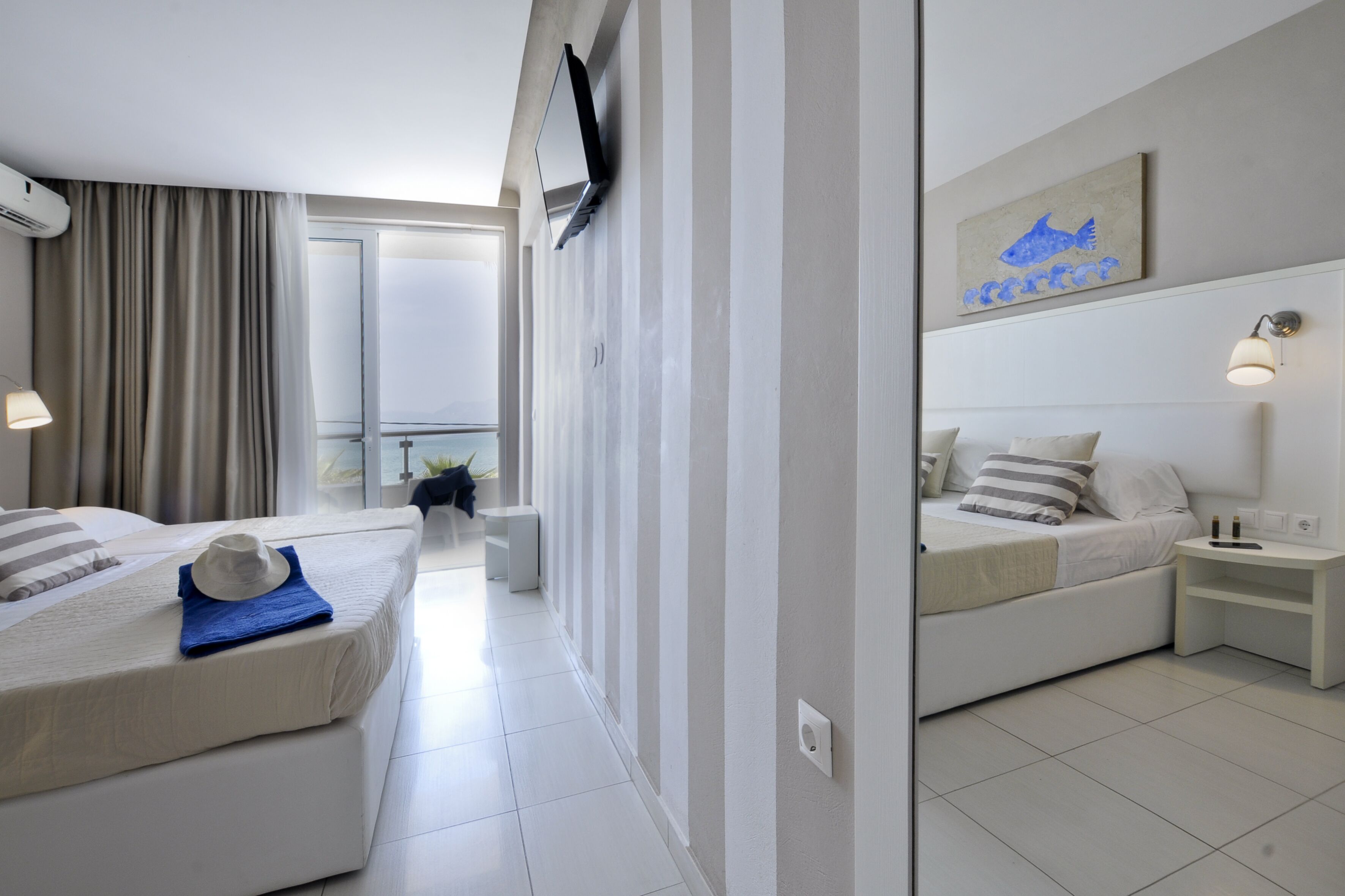triple room (sea view front) | 1 bedroom, minibar, in-room safe, blackout curtains