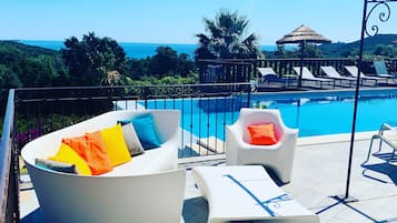 Outdoor pool, pool umbrellas, sun loungers