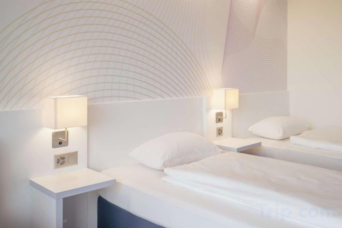 Hypo-allergenic bedding available, down comforters, in-room safe, desk