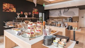 A buffet area with various food items and a coffee station. - Prize by Radisson, Zurich Affoltern am Albis (Affoltern am Albis)