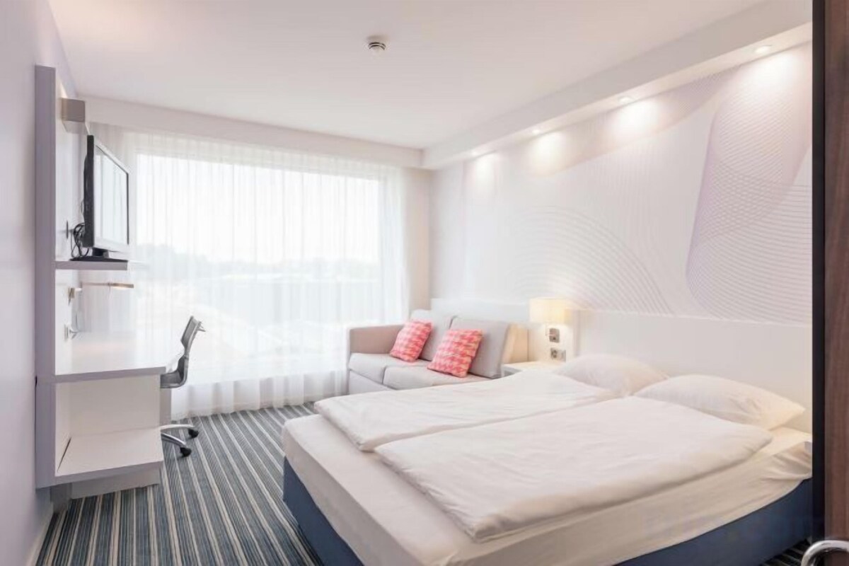 Hypo-allergenic bedding available, down comforters, in-room safe, desk