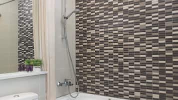 Separate bathtub and shower, eco-friendly toiletries, hair dryer