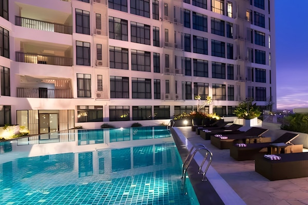 Outdoor pool, open 6:00 AM to 10:00 PM, pool umbrellas, sun loungers