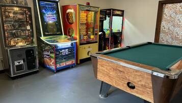 Enjoy a game night in with a pool table and arcade machines.