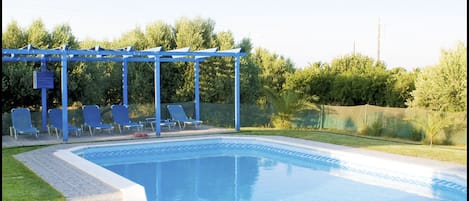 Seasonal outdoor pool, pool loungers