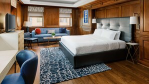A modern hotel room with a large bed, a desk, a sofa, and a TV. - Hampton Inn Washington, D.C./White House (Washington)