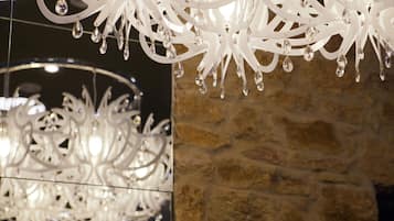A chandelier with multiple light fixtures and hanging crystals.