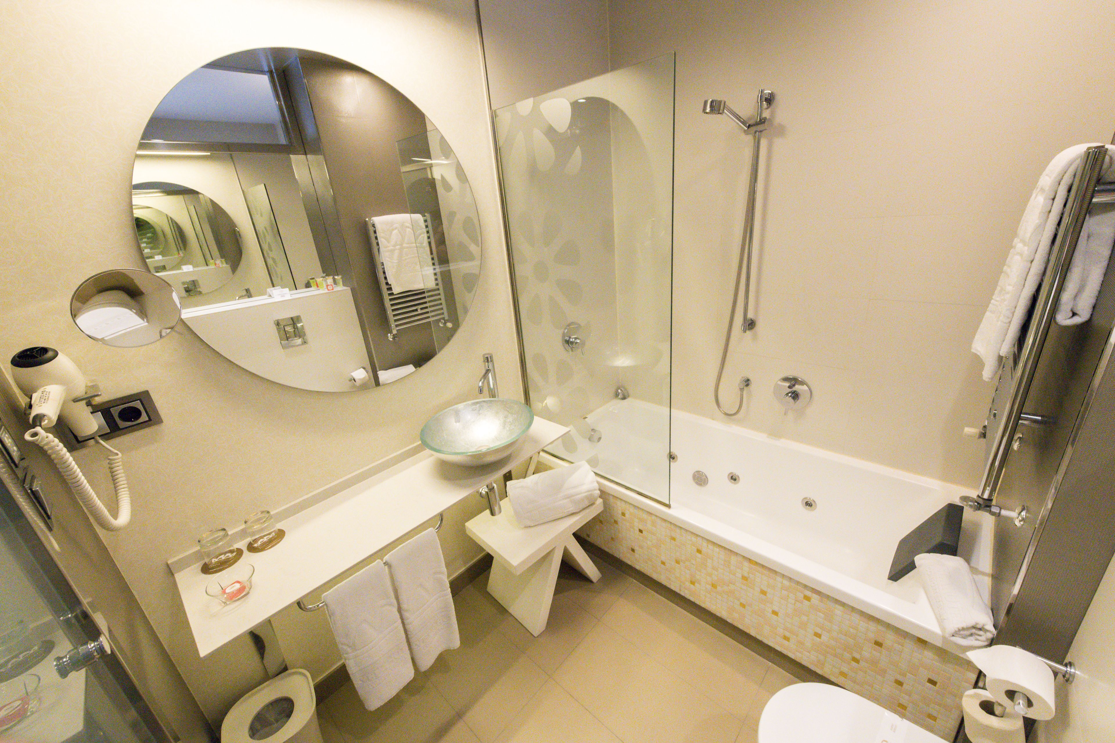 economy room, 1 queen bed, jetted tub | bathroom | free toiletries, hair dryer, towels, soap