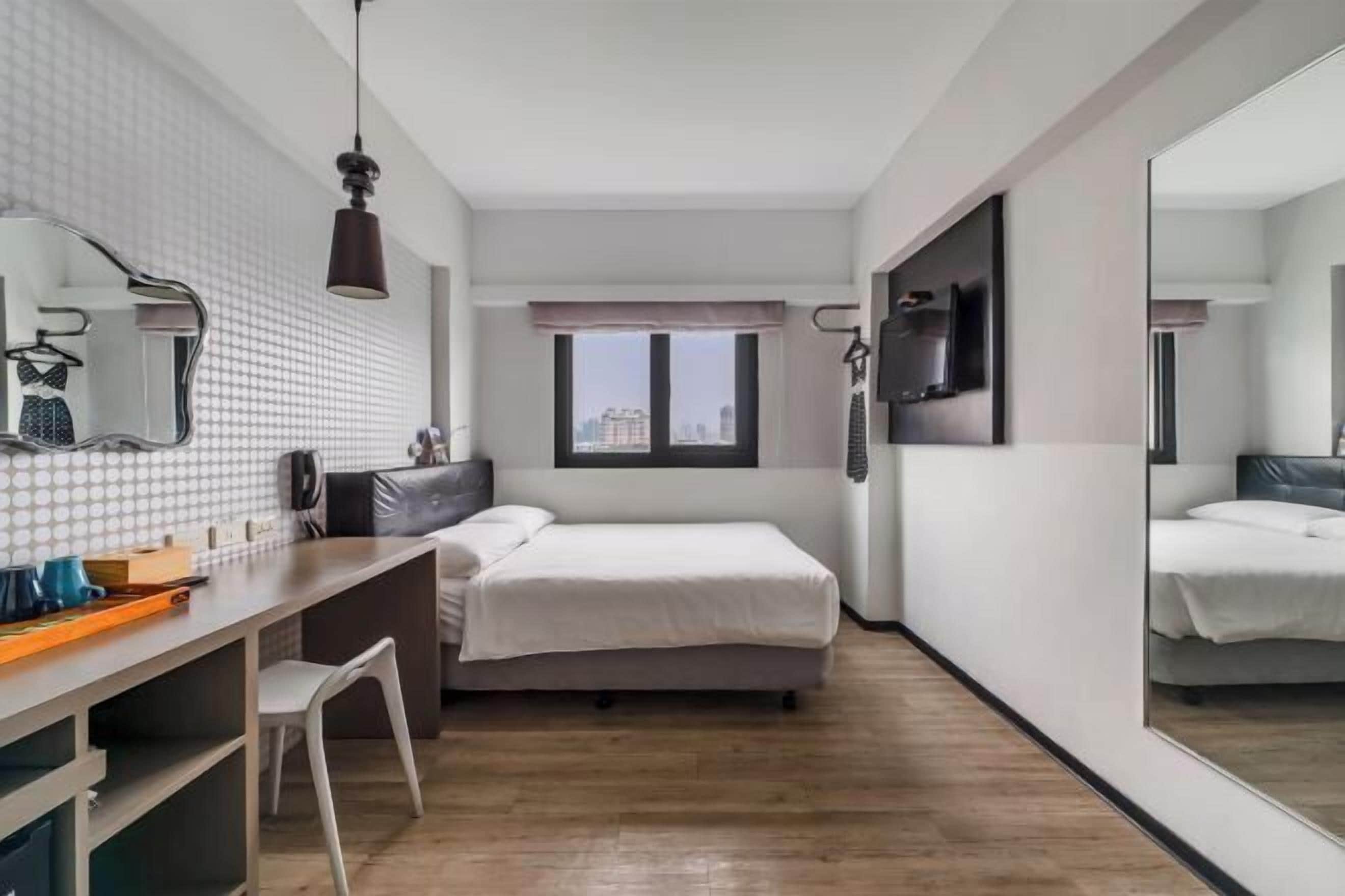 Desk, blackout drapes, soundproofing, free wired internet