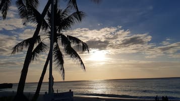 Private beach, white sand, sun loungers, beach umbrellas