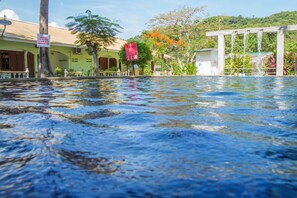 A swimming pool with a sign indicating no swimming.