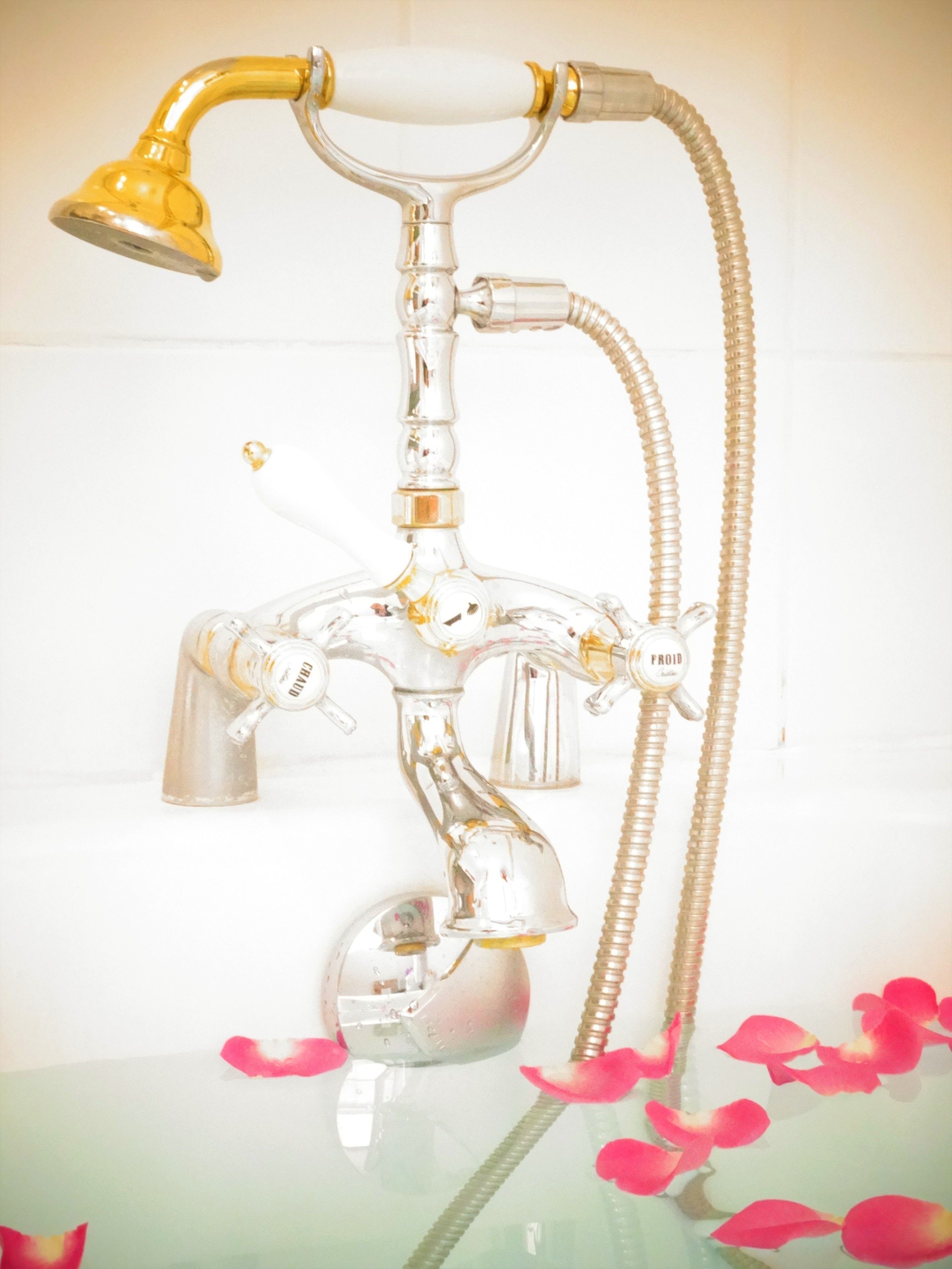 combined shower/bathtub, designer toiletries, hair dryer, towels