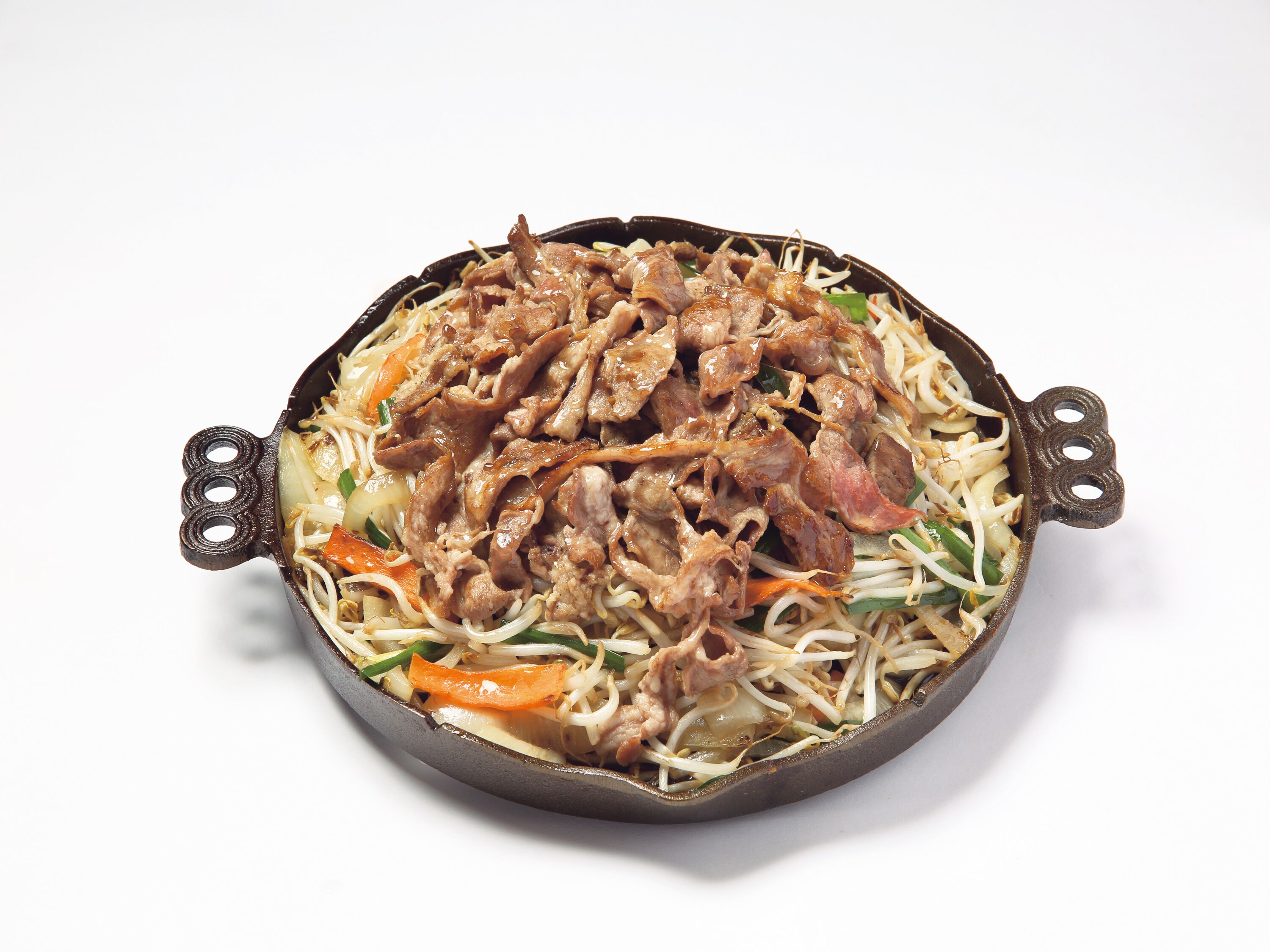 A bowl of stir-fried noodles with vegetables and meat.