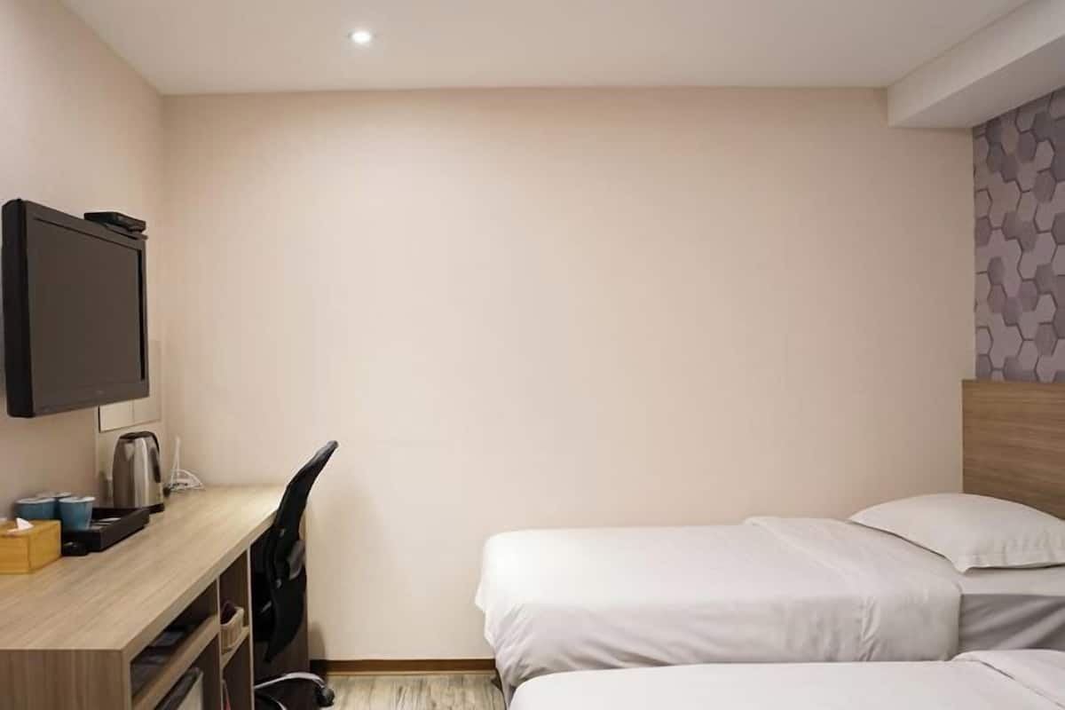 Donzen dekbedden, een minibar, verduisterende gordijnen