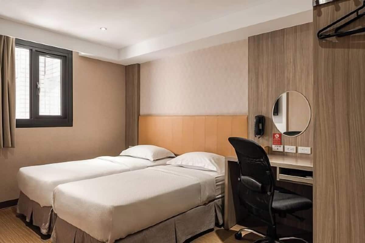 Donzen dekbedden, een minibar, verduisterende gordijnen