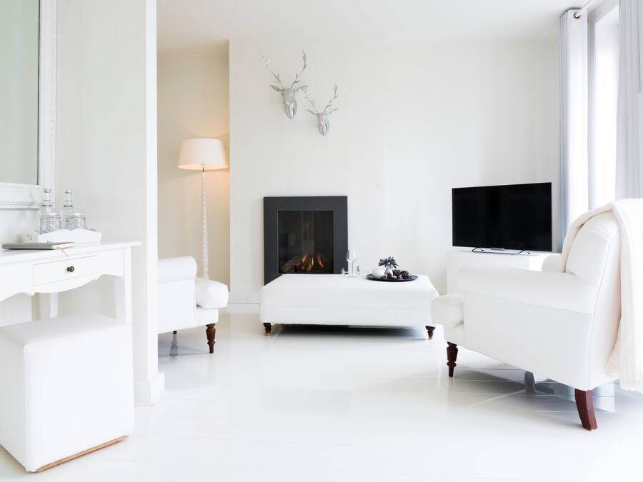 Superior Suite | Living room | TV, fireplace, DVD player, iPod dock