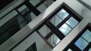 A multi-story building with a modern architectural design, featuring large windows and a clean, white facade. - Montevideo Chic Boutique Hostel (Montevideo)