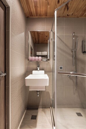 Shower, hair dryer, towels, shampoo