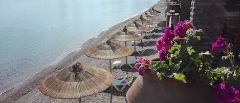 On the beach, sun-loungers, beach umbrellas