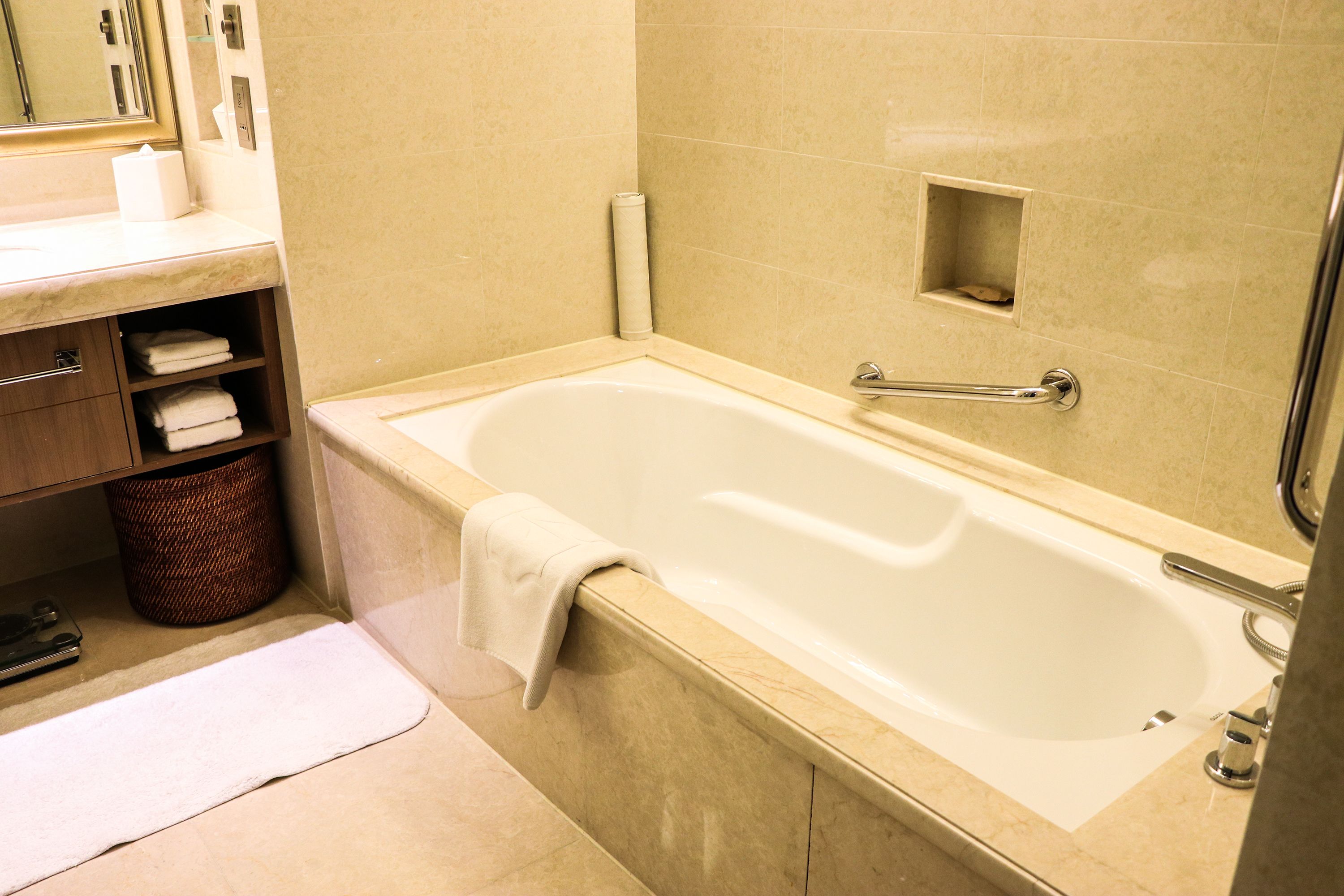 separate bathtub and shower, designer toiletries, hair dryer, slippers