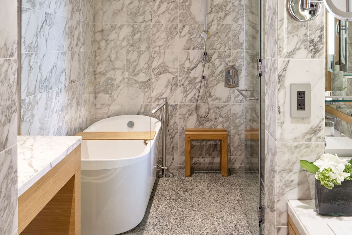 junior suite, 1 king bed | bathroom | separate bathtub and shower, deep-soaking bathtub