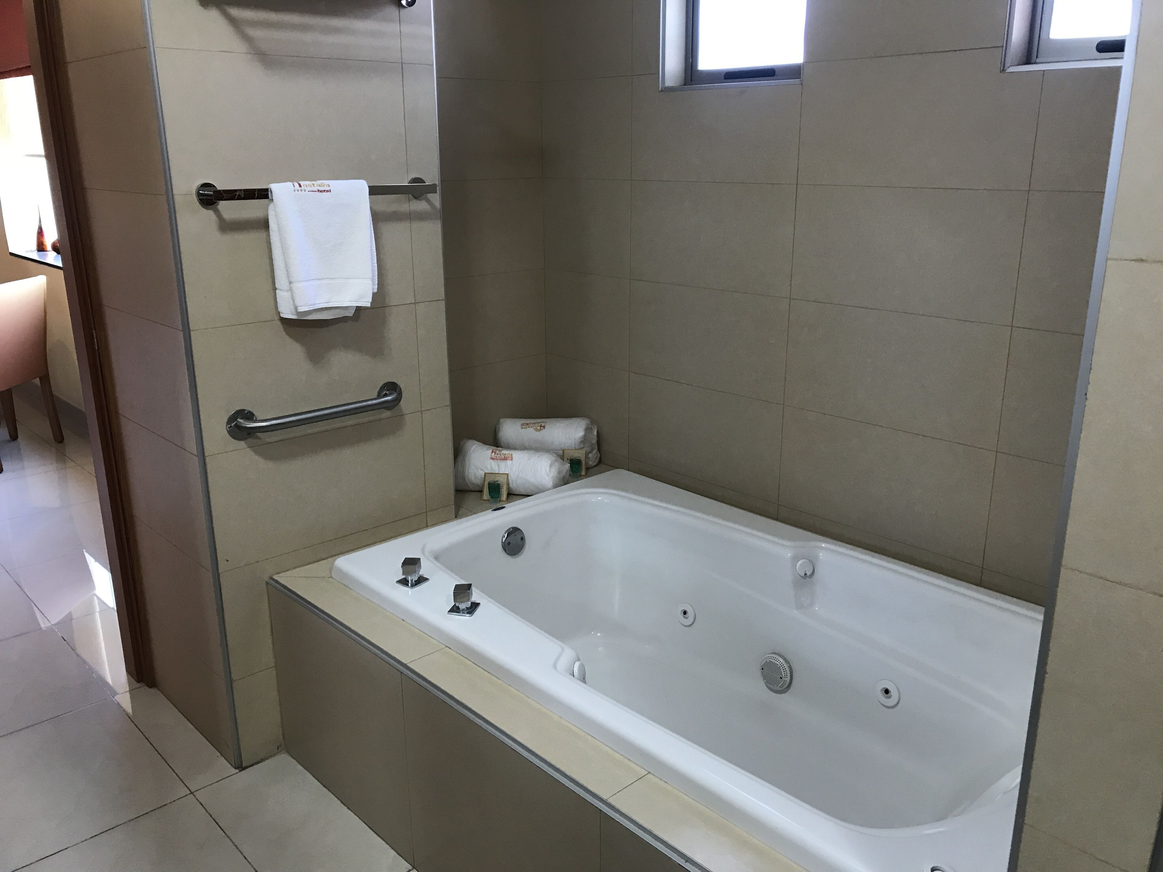 junior studio suite | bathroom | shower, rainfall showerhead, free toiletries, hair dryer