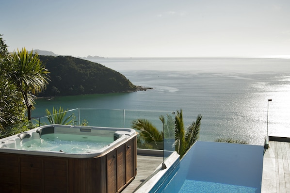 Outdoor pool, an infinity pool, pool loungers