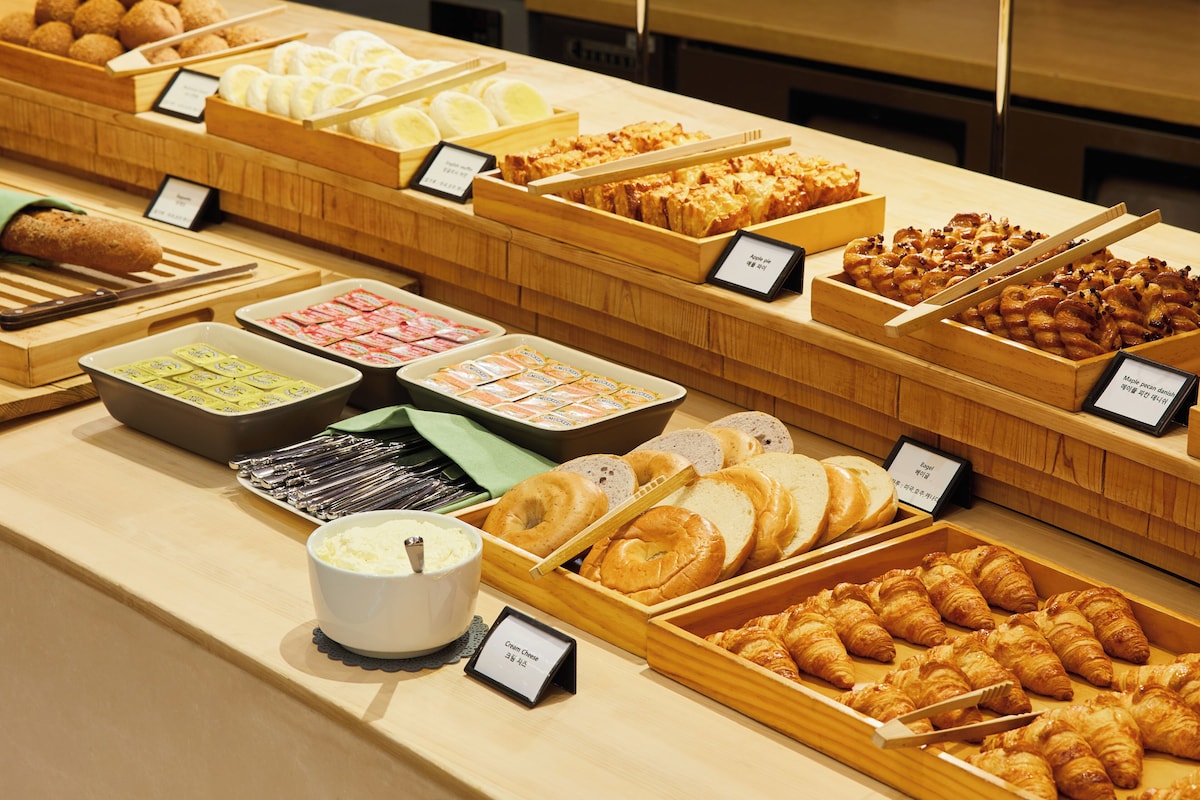 A bakery display with various pastries and baked goods.