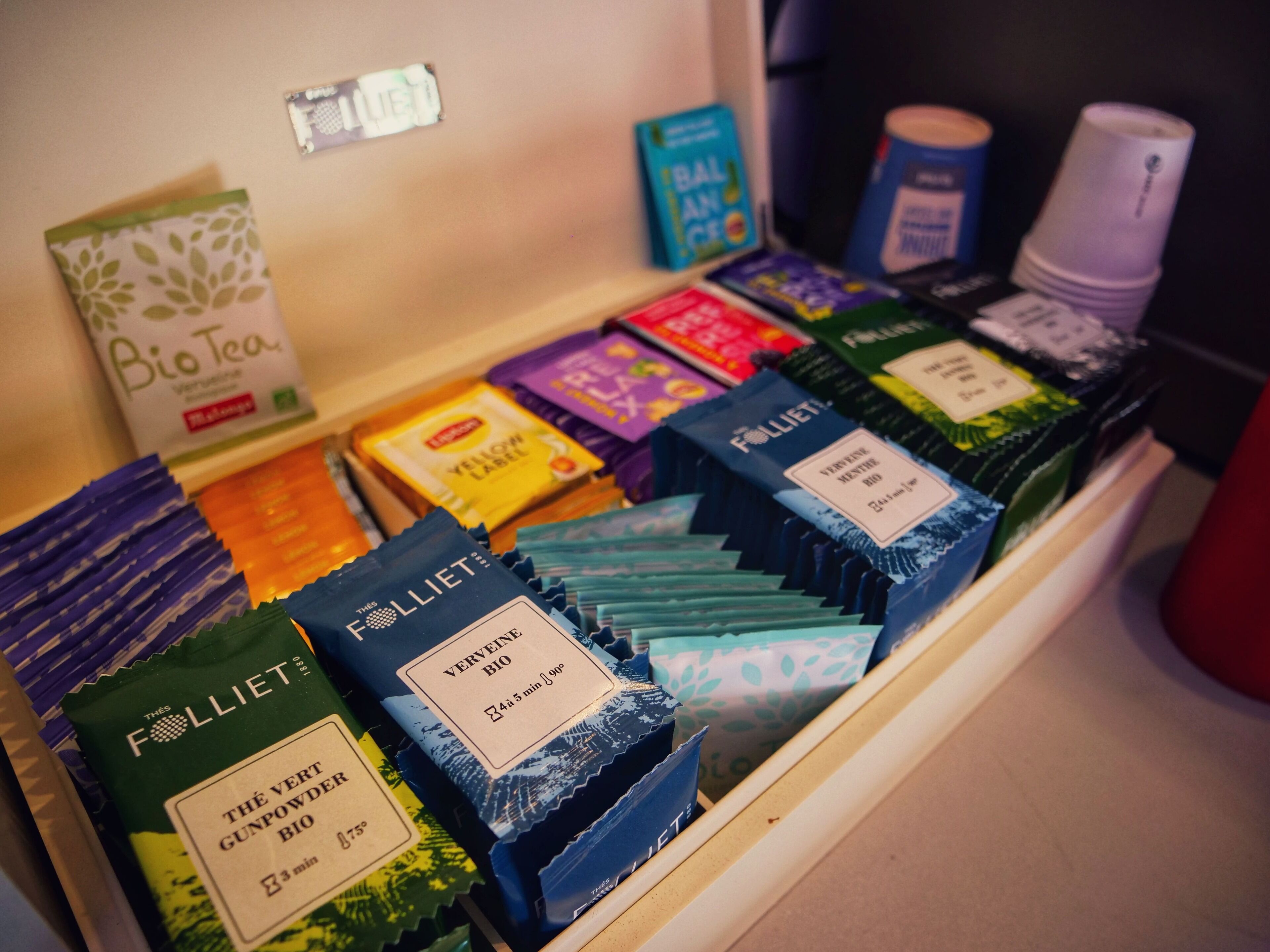 A display of various tea products in a store.