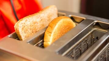 A toaster with two slices of bread.