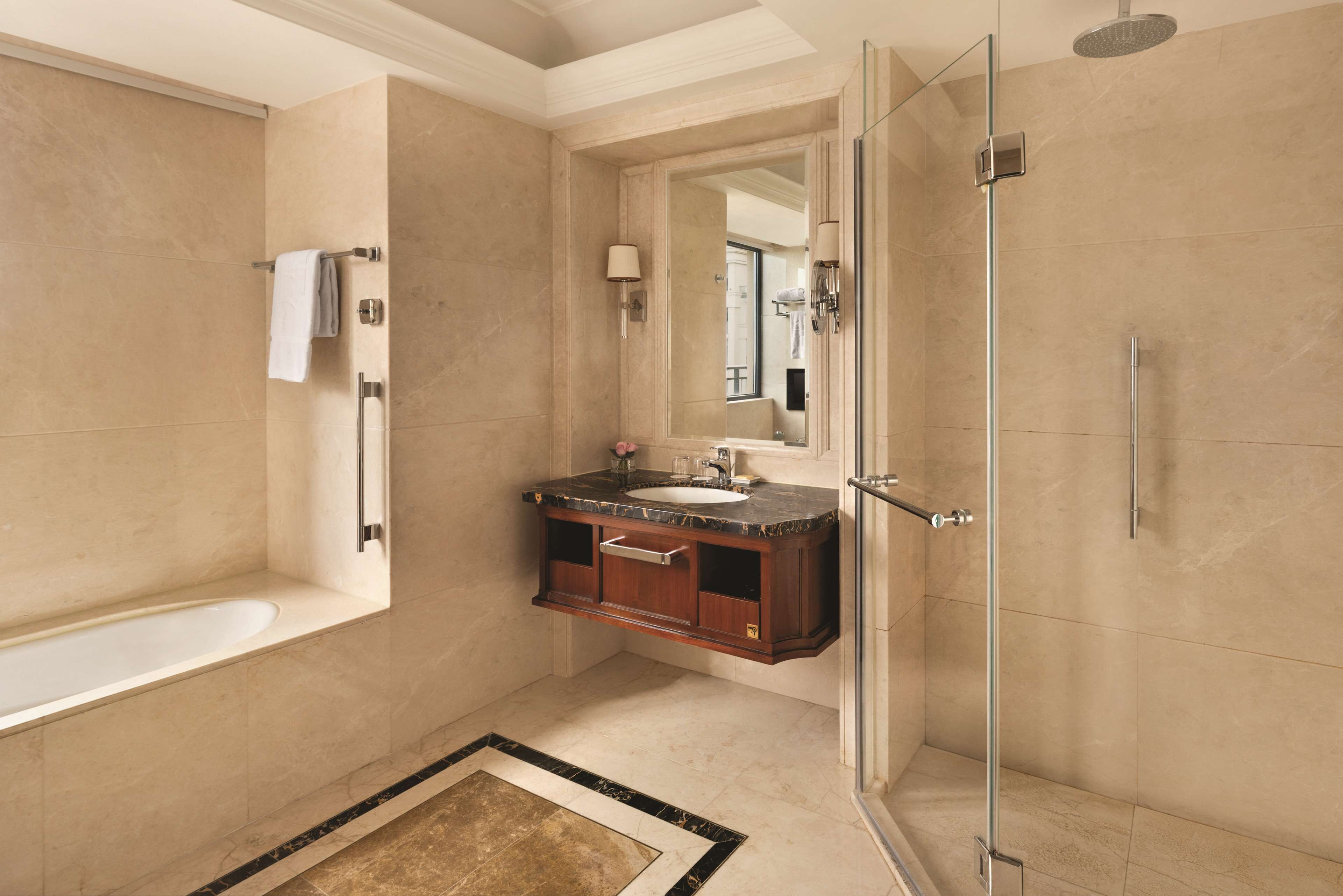 separate bathtub and shower, rainfall showerhead, designer toiletries