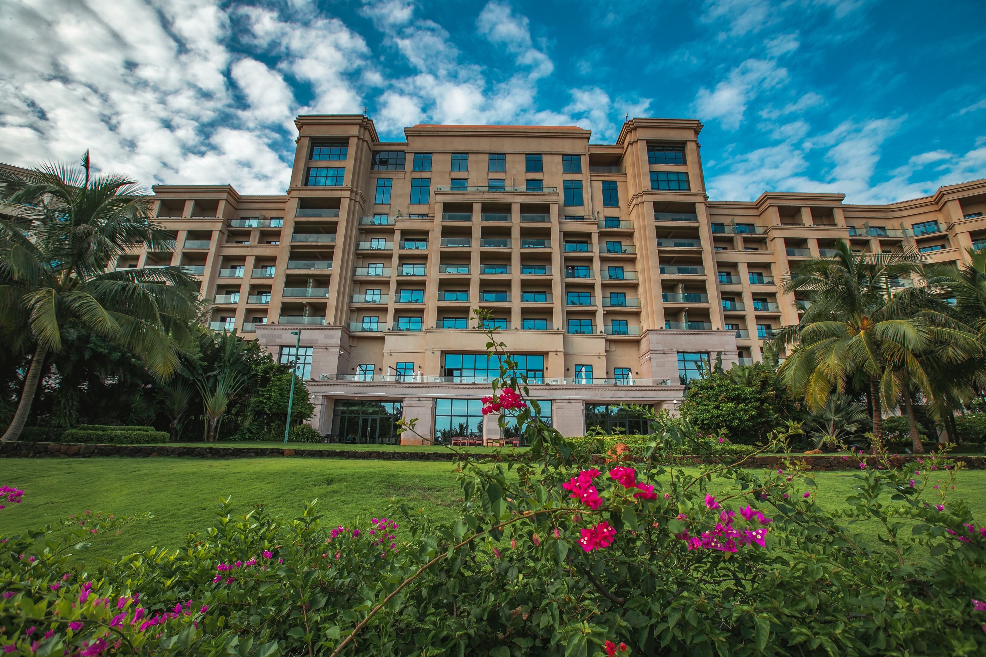 A multi-story hotel with a symmetrical facade, large windows, and a central entrance.