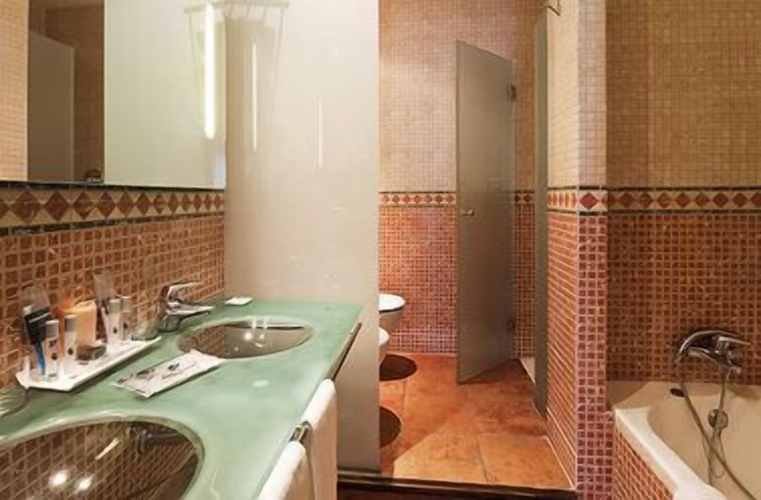 shower, hair dryer, bidet, towels