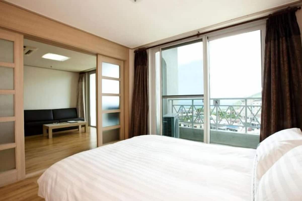 2 bedrooms, down comforters, blackout drapes, soundproofing