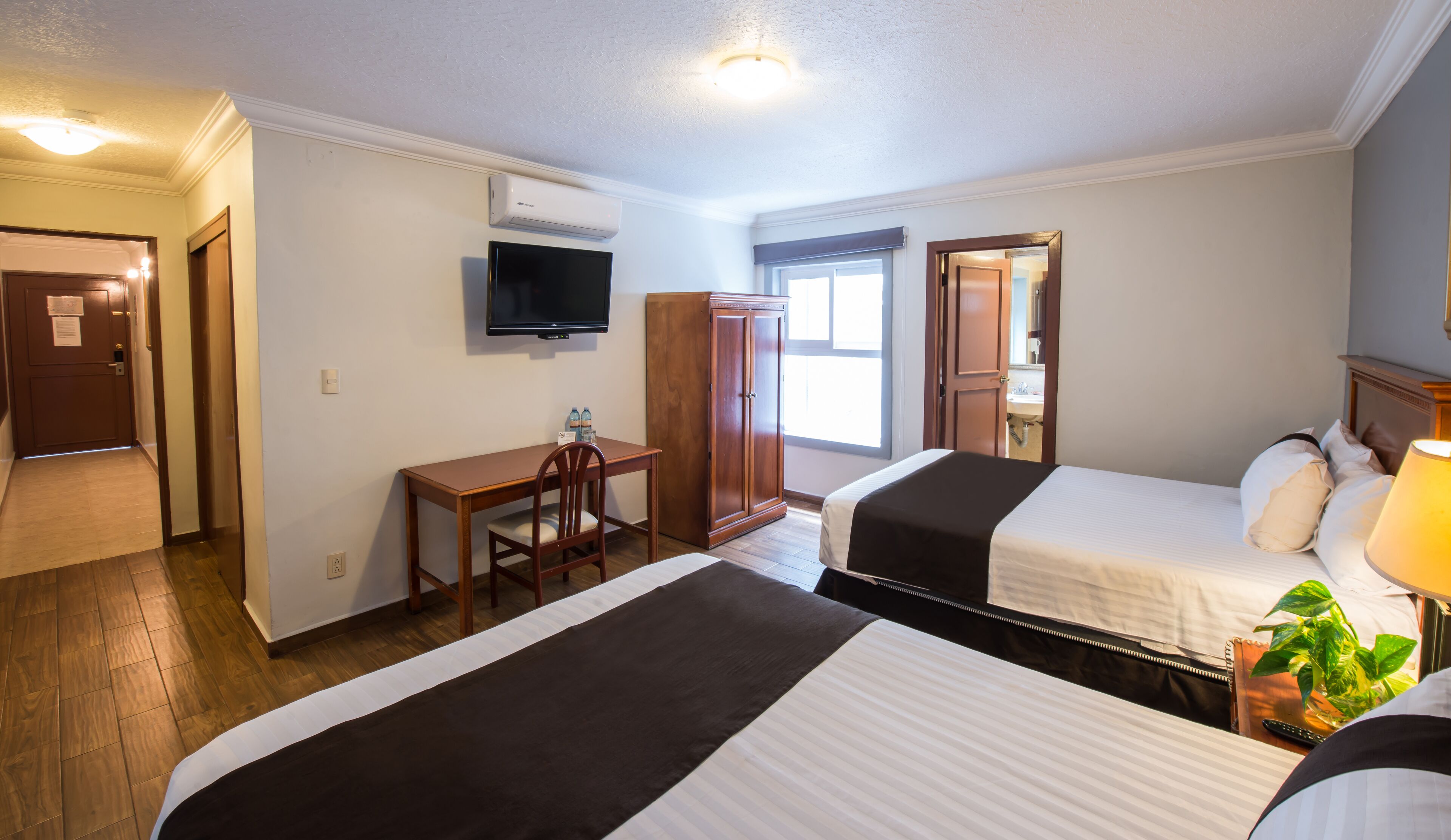 standard room, 2 double beds | in-room safe, desk, iron/ironing board, free cots/infant beds