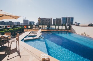 Outdoor pool, pool umbrellas, sun loungers