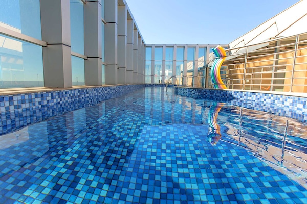 Indoor pool, outdoor pool, pool umbrellas, sun loungers