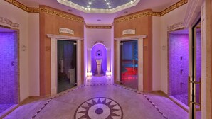 A hotel corridor with a central atrium, a tiled floor, and a ceiling with star-like lights. - Hotel Elizabeth (Trencin)