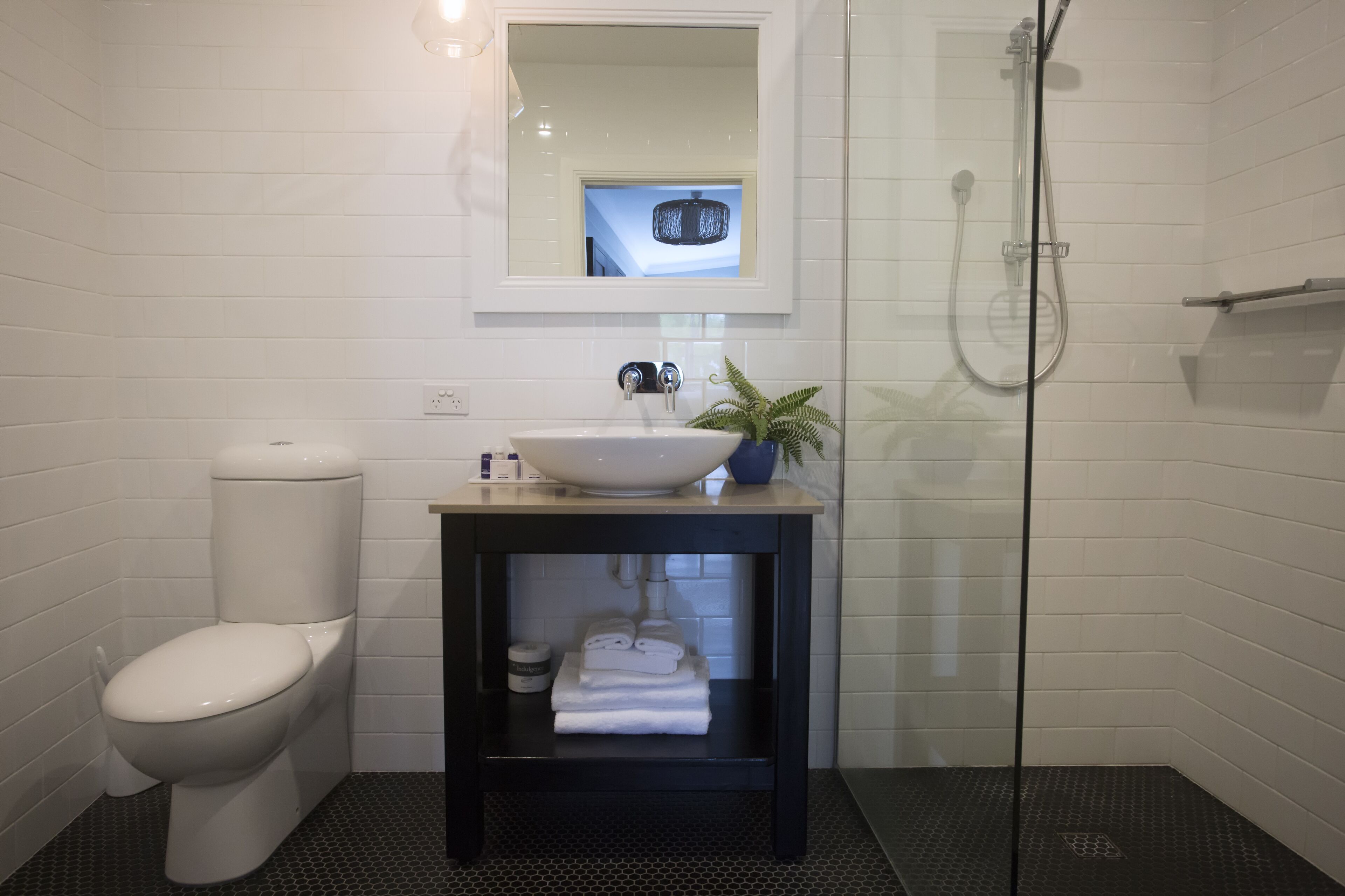 deluxe king room | bathroom | free toiletries, hair dryer, soap, shampoo