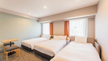 A hotel room with two single beds, a small table, and a bench.