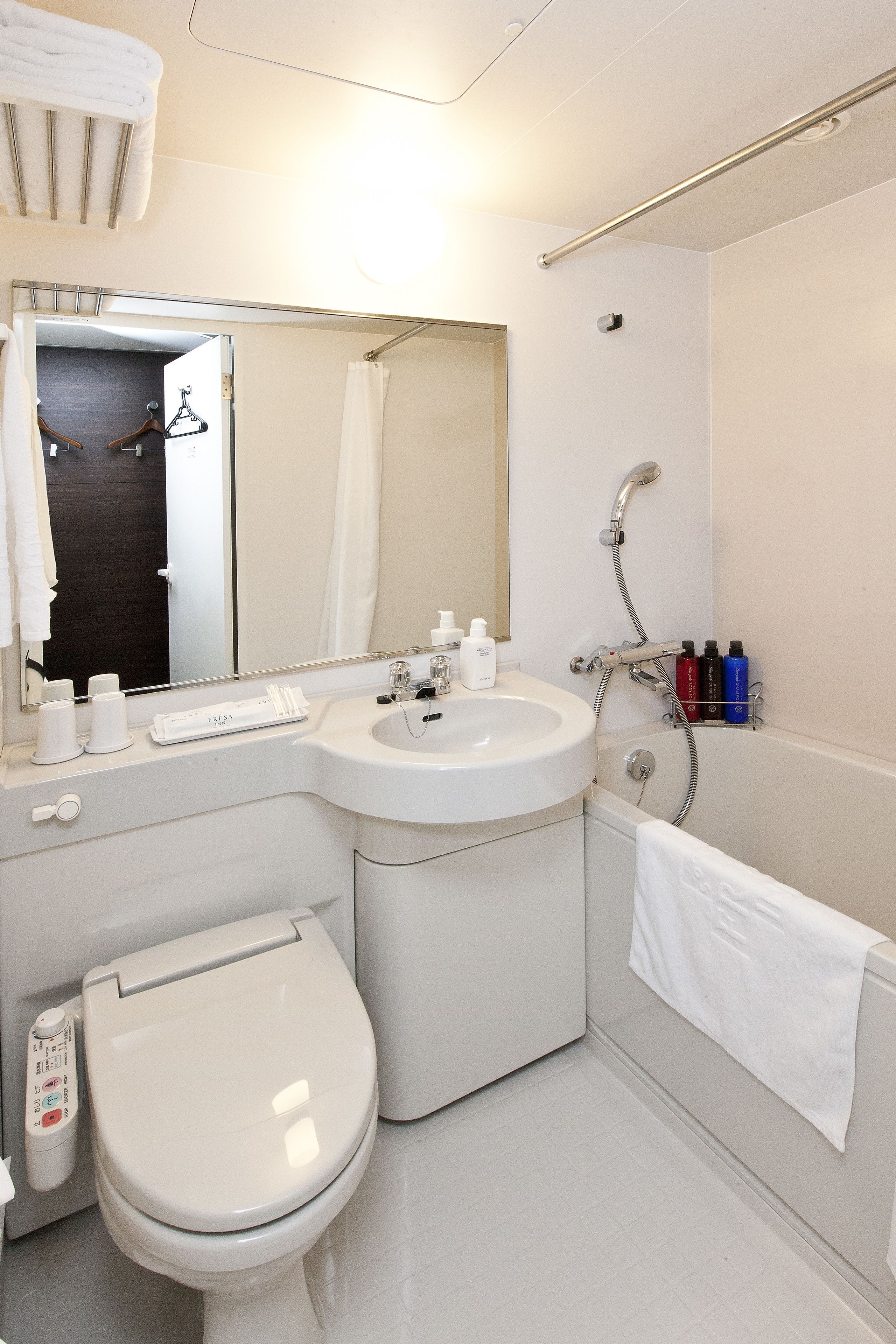 combined shower/bathtub, free toiletries, hair dryer, slippers